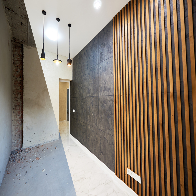 New kitchen before and after refurbishment, interesting combination of black and wood plank wall texture, shiny tiles on the floor and different modern chandeliers hanging from ceiling